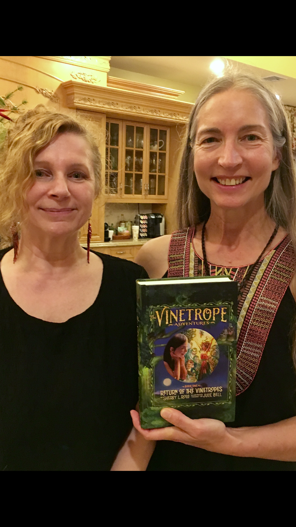 Sherry Ross and Julie Bell holding The Vinetrope Adventures